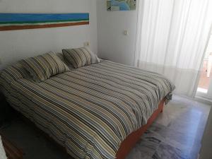 Posteľ alebo postele v izbe v ubytovaní Apartamentos Aretusa Zahara