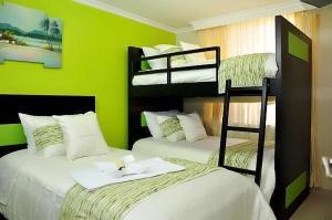 Postel nebo postele na pokoji v ubytování Hotel Tababela Land