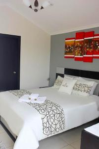 Postel nebo postele na pokoji v ubytování Hotel Tababela Land