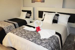 Postel nebo postele na pokoji v ubytování Hotel Tababela Land