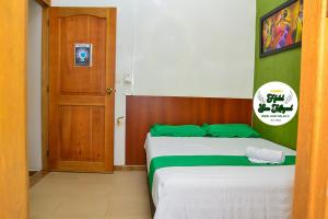 Postel nebo postele na pokoji v ubytování Hotel San Miguel Apartadó + 8 fotografií