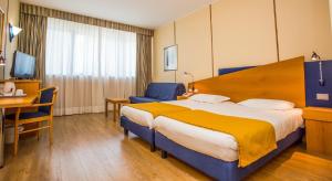 Postel nebo postele na pokoji v ubytování Hotel Express Aosta East