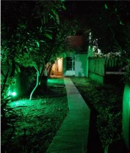 a garden at night with a green pathway at Solar de Paz in Rivera