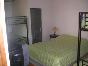 Postel nebo postele na pokoji v ubytování Iquique Beachfront + 14 fotografií