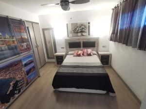 Postel nebo postele na pokoji v ubytování APARTAMENTO GALTOR 10