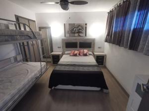 Postel nebo postele na pokoji v ubytování APARTAMENTO GALTOR 10