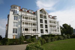 a large white building with balconies on it at Meeresblick in Kühlungsborn