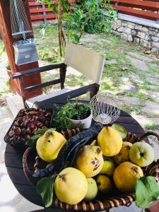 a basket of fruit and vegetables on a table at Theasis-Igloo in Ágnanta
