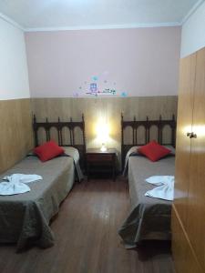 
A bed or beds in a room at Hotel Entre Rios
