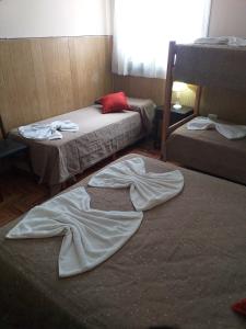 
A bed or beds in a room at Hotel Entre Rios
