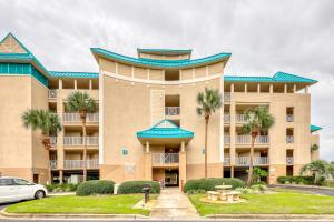 a building with palm trees in front of it at Amalfi Coast B420 in Destin