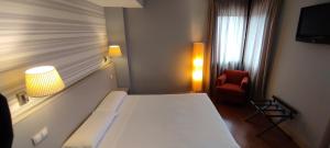 
Cama o camas de una habitación en Hotel Puerta del Arco
