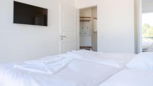 Postel nebo postele na pokoji v ubytování Apartmenthaus Wittsande Wittsande 10
