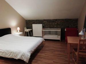Postel nebo postele na pokoji v ubytování La Ferme Oubliée