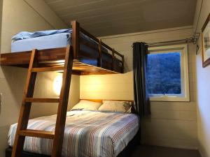 a bedroom with a bunk bed and a bunk bedouble at Aneeki Ski Lodge in Thredbo +22 photos