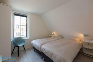 Postel nebo postele na pokoji v ubytování Appartement - Kaapduinseweg 13 Dishoek 13E Luxe 6 personen