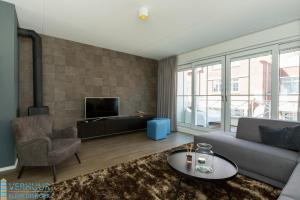TV a/nebo společenská místnost v ubytování Appartement - Kaapduinseweg 13 Dishoek 13F Luxe 6 personen