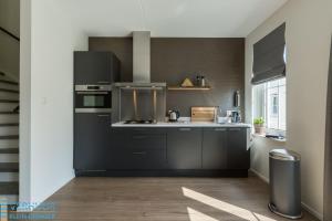 Kuchyň nebo kuchyňský kout v ubytování Appartement - Kaapduinseweg 13 Dishoek 13F Luxe 6 personen