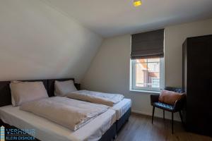 Postel nebo postele na pokoji v ubytování Appartement - Kaapduinseweg 13 Dishoek 13F Luxe 6 personen