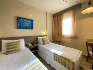 Cama ou camas em um quarto em Hotel Caiçara João Pessoa
