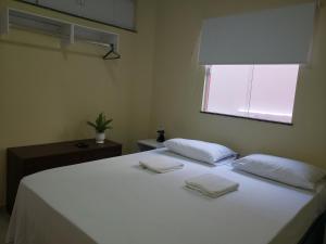 Pousada Litorânea客房内的一张或多张床位