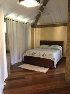 Ένα ή περισσότερα κρεβάτια σε δωμάτιο στο Casa Buzios Geriba