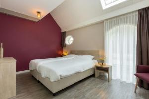 Postel nebo postele na pokoji v ubytování Vakantiewoning - Noordweg 56a Oostkapelle Comfort 4 personen