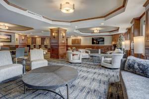 a lobby with couches and chairs and a table at River Mtn Lodge E205 in Breckenridge