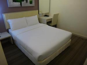 Katil atau katil-katil dalam bilik di Kosma Business Hotel