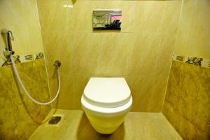 a bathroom with a toilet and a shower at HOTEL KEK GRAND PARK in Chennai