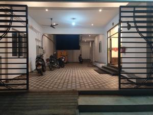 a hallway with motorcycles parked in a building at Hotel Rani and Rani Residency in Puducherry