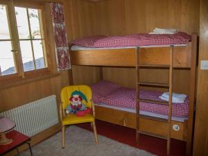 Ένα ή περισσότερα κρεβάτια σε δωμάτιο στο Chalet Sturmfang