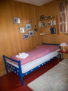 Ένα ή περισσότερα κρεβάτια σε δωμάτιο στο Chalet Sturmfang