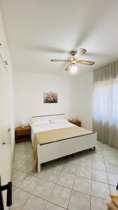A bed or beds in a room at I Giardini Dell'Agave