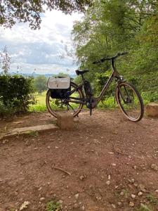 a bike is parked in a dirt field at Vakantiewoning Petit Watou in Poperinge