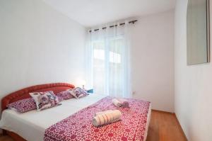 Postel nebo postele na pokoji v ubytování Kuća za odmor Jadra&Sina