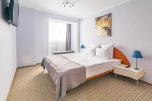 Posteľ alebo postele v izbe v ubytovaní Zvezdnaya Hotel