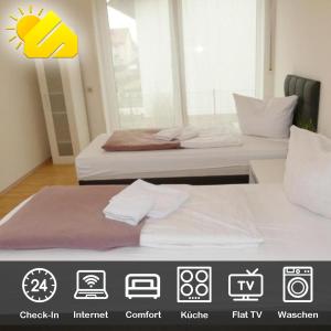 2 camas en una habitación con anadobeadobe en SUNNYHOME Monteurwohnungen und Apartments in Schwandorf en Schwandorf in Bayern