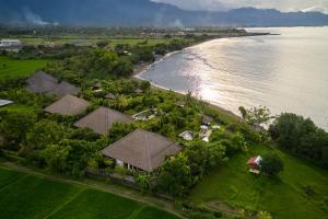 an aerial view of a house next to the water at The North Cape Beach Villas in Umeanyar