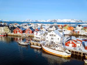 an aerial view of a harbor with boats in the water at Villa Bryggekanten - by Classic Norway Hotels in Henningsvær