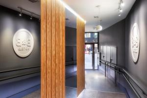 a hallway with a wooden door in a building at B&B HOTEL Madrid Centro Fuencarral 52 in Madrid