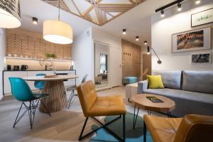 a living room with a couch and a table at VISLOW Resort in Wisła