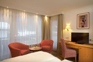 TV a/nebo společenská místnost v ubytování Hotel Menning ***S