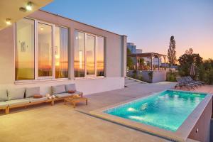 a swimming pool in the backyard of a house at Villa San Mauro in Momjan