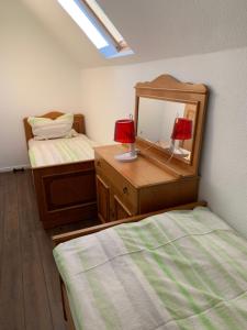 En eller flere senger på et rom på Ferienwohnung_25