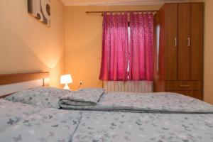 Postel nebo postele na pokoji v ubytování Apartments Andrić