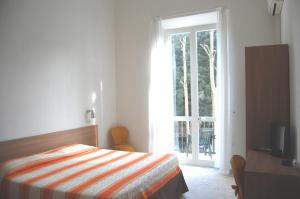 Cama o camas de una habitación en Hotel Derna