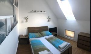 Postel nebo postele na pokoji v ubytování Petra Vendégház