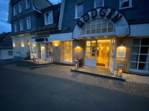 a store front of a building at night at Hotel Haus Rödgen in Wilnsdorf
