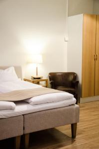 Säng eller sängar i ett rum på Hotel Vanilla